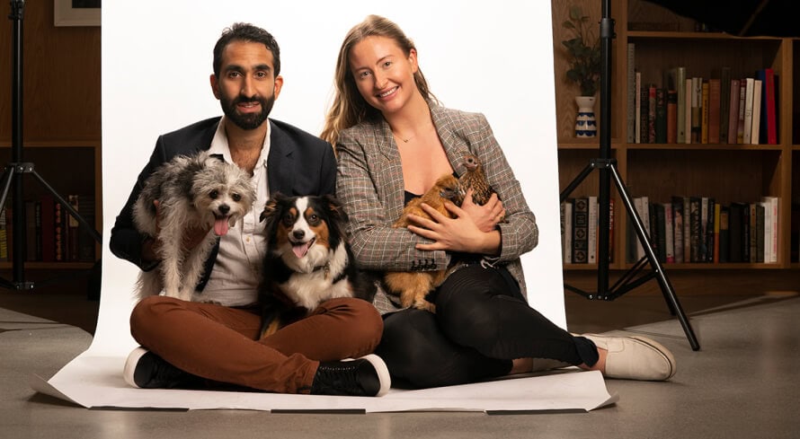 Manick Bhan with two dogs at press and media event.
