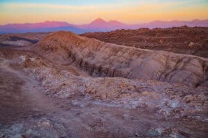 Desert landscape with colorful rock formations during sunset, showcasing natural beauty and geologic.